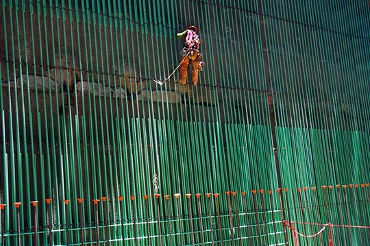 Construction worker in a harness