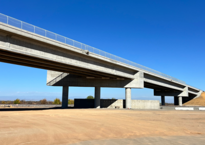Photo of overpass on Avenue 17 from ground level perspective.