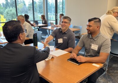 Attendees hold a one-on-one meeting during the Authority’s 2025 Small Business Fair in Burlingame.